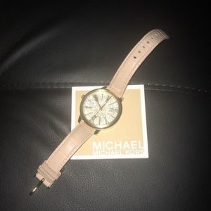 Woman’s Pink and Gold Michael Kors Watch
